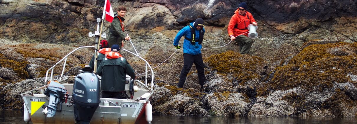 Mossom deploys receivers to track the migration of coho smolts in the Vancouver Harbour.