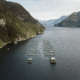 An aerial view of ppen-net pen salmon farms in the Broughton Archipelago in 2022. Photo by Brandon Deepwell.